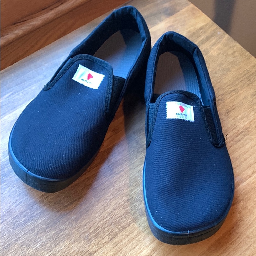 Anotomic black canvas slip ons. Similar to Vans but with a wide toe box